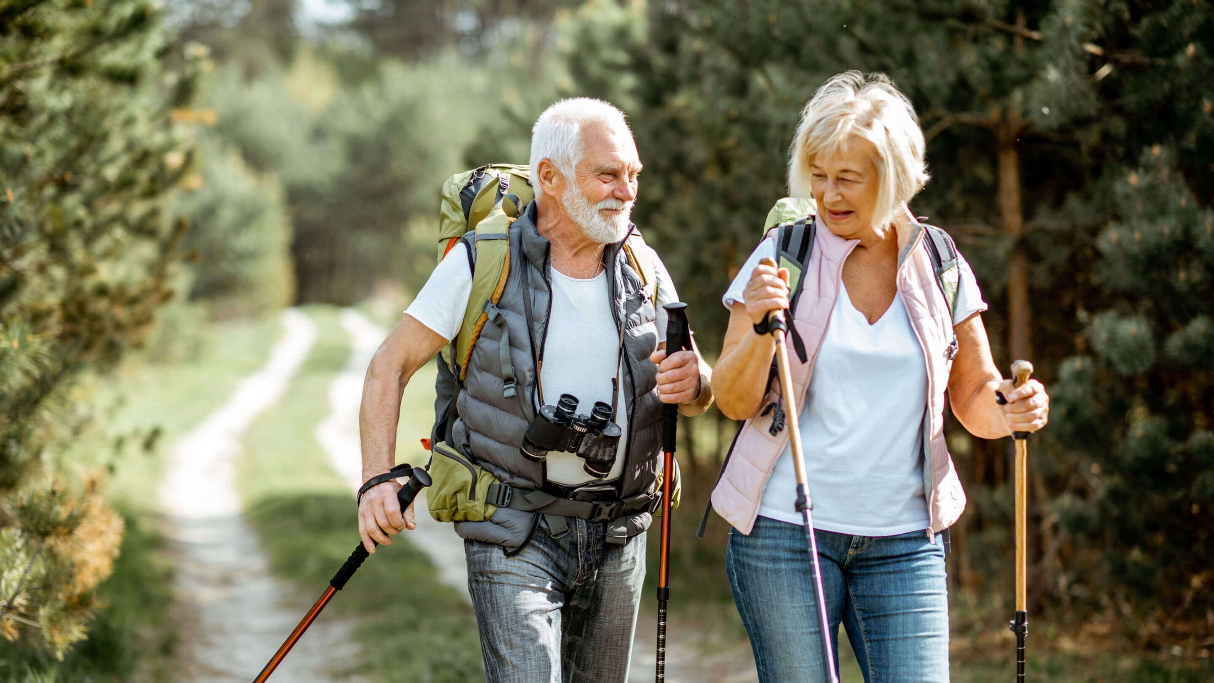 Senior couple hiking in the forest